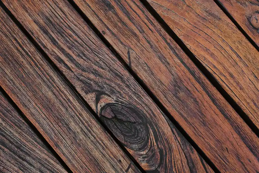 Detailed view of weathered wooden planks showing natural grain and texture.